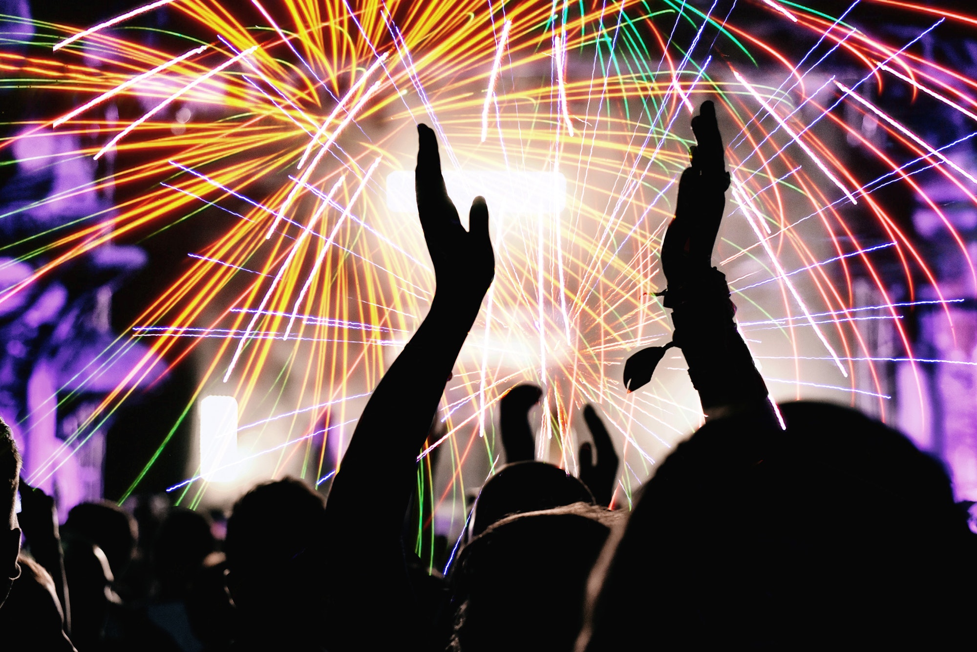 Cheering crowd and fireworks at New Year's Eve party